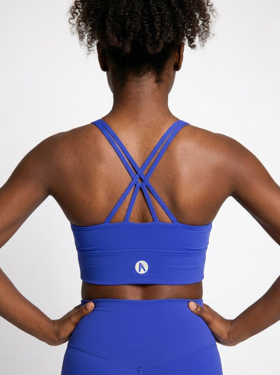 Blue racerback sports bra back view with stretch support design
