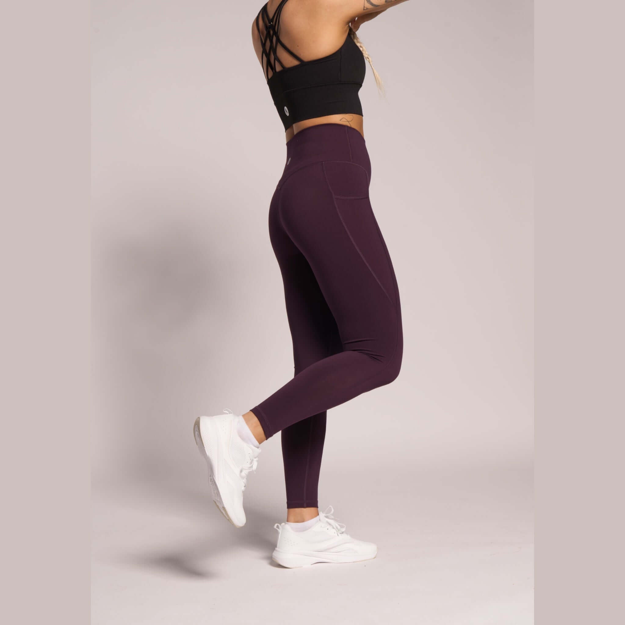 Supportive dark purple leggings with sculpting fit