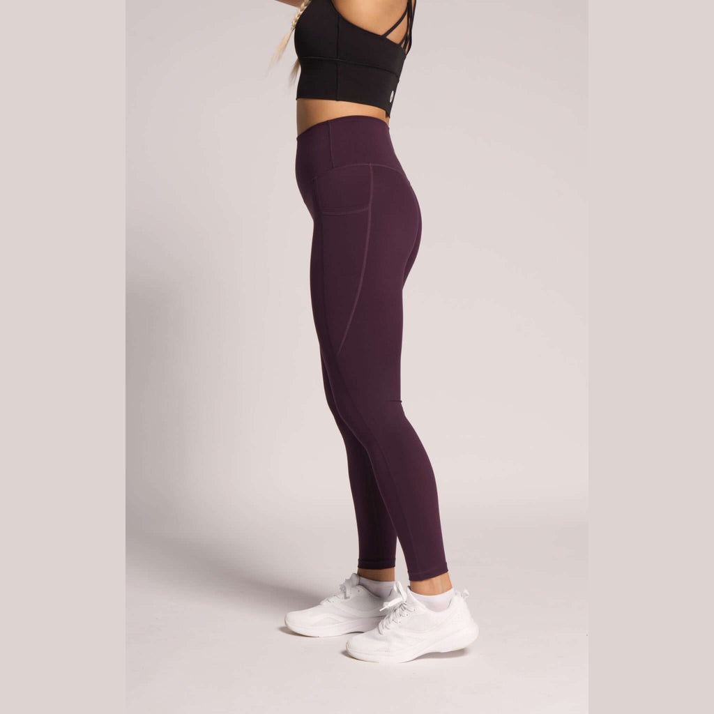 Dark purple high-waisted leggings with phone pockets
