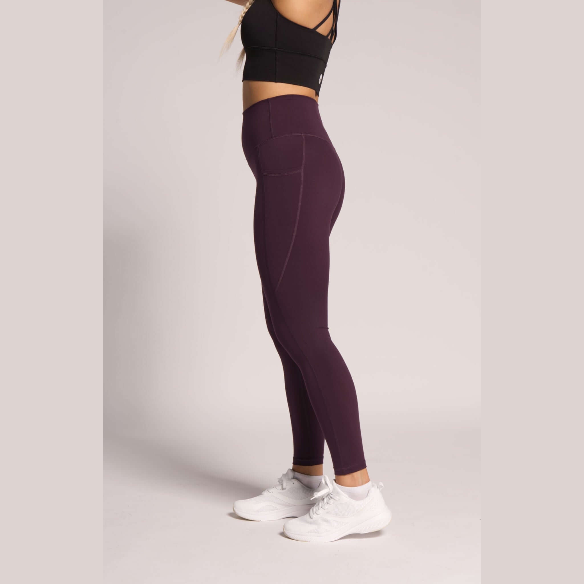Dark purple high-waisted leggings with phone pockets