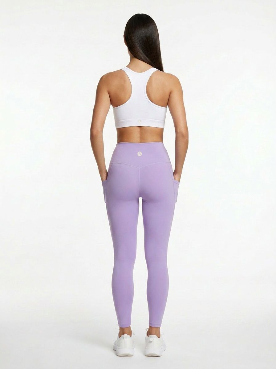 women wearing a white sports bra and Lilac squat proof activewear leggings with pockets and high waist fit
